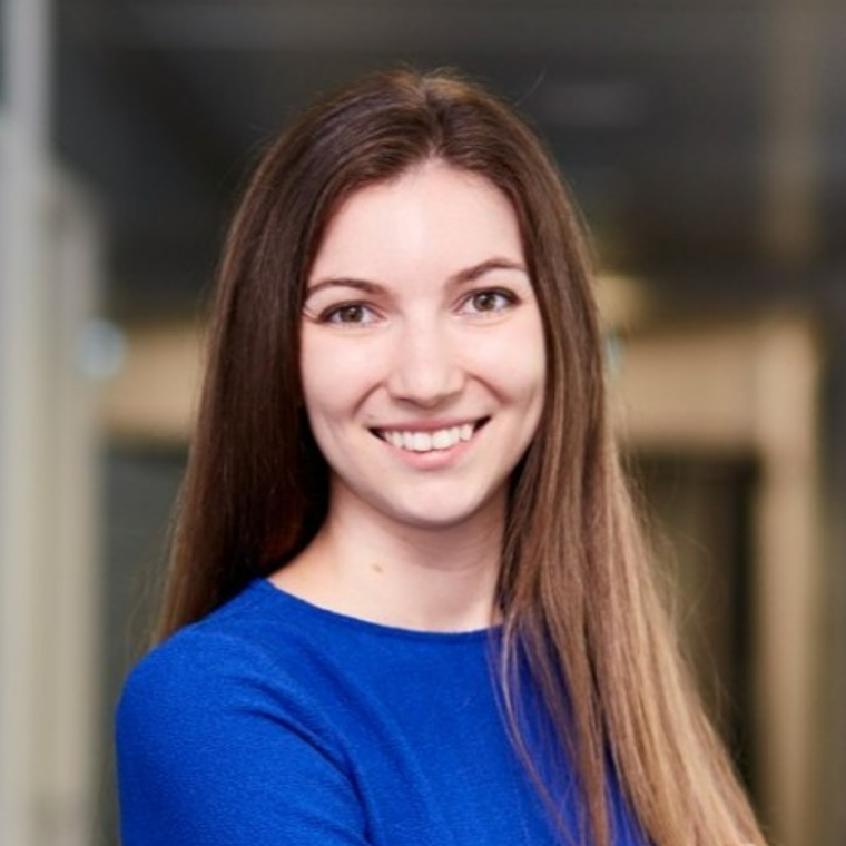 A professional headshot of Bianka Gallina, smiling in a blue outfit.