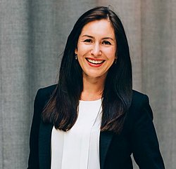 Olga Antonava Portrait A professional headshot of Olga Antonava, smiling and dressed in business attire.