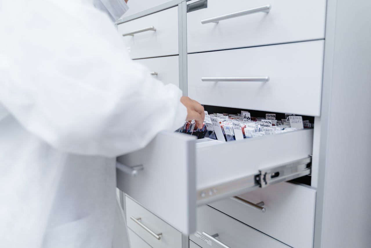 Organised medical records in a hospital drawer.