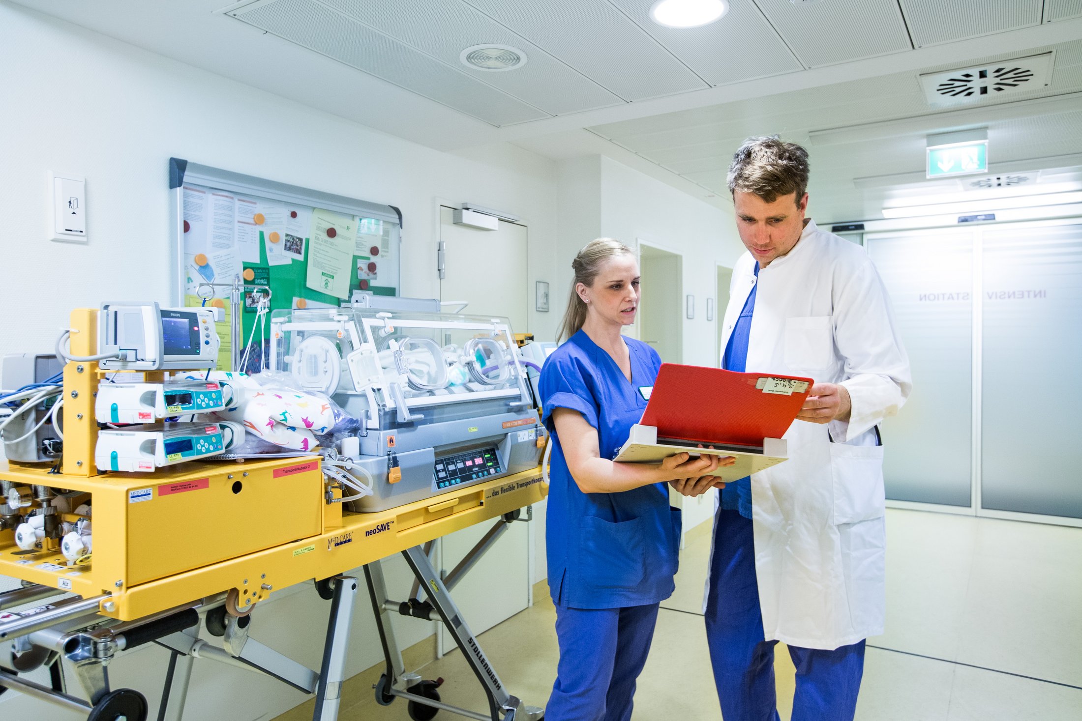 Medical team discussing treatment for premature baby.