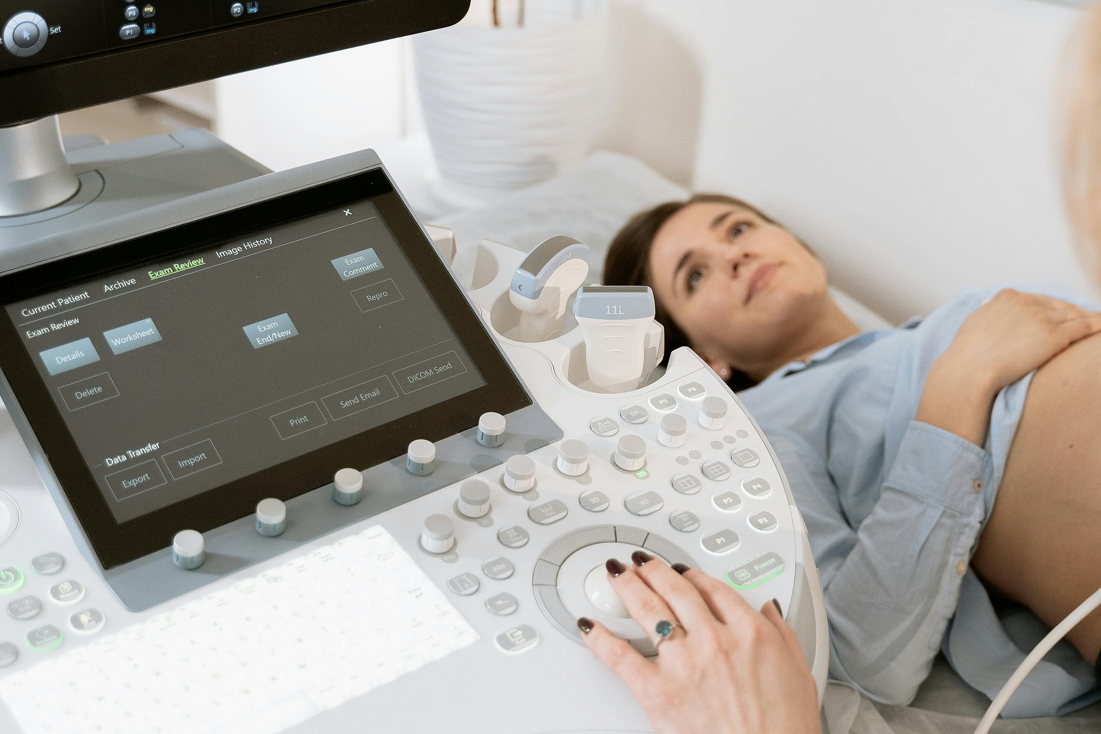 Ultrasound machine displaying a baby’s image on the screen.