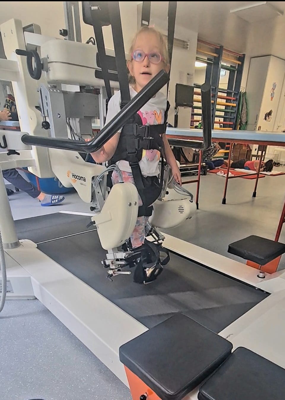 Collage of Ioana, a former preterm baby, doing different therapies including walking, swimming, and balance exercises.