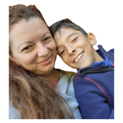 Alex, a former preterm baby, smiling in his mother Ileana’s arms, showing their loving bond and journey through prematurity.